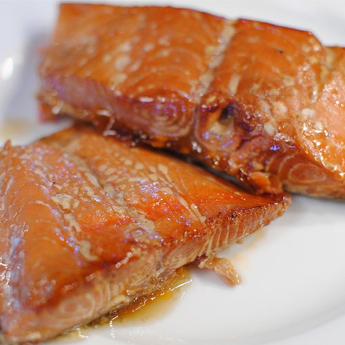 wild sockeye smoked salmon retort on a plate close-up
